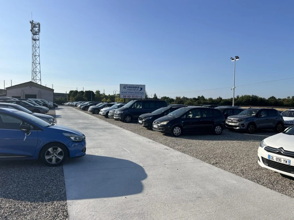 A man sitting at the front desk of a small office.